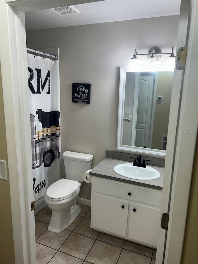 3287 Rackley Rd, Brooksville, FL 34604 - bathroom with tile patterned flooring, vanity, toilet, and a shower with shower curtain