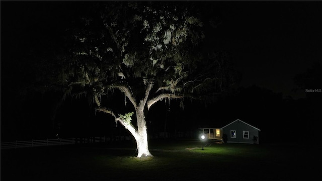 3287 Rackley Rd, Brooksville, FL 34604 - yard at night with a lawn