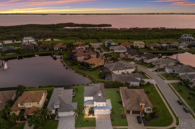 5718 Title Row Dr, Bradenton, FL 34210 - aerial view at dusk of a residential view and a water view