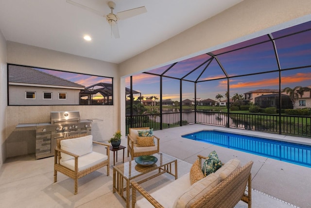 5718 Title Row Dr, Bradenton, FL 34210 - view of swimming pool with exterior kitchen, a patio, outdoor lounge area, a lanai, and a water view