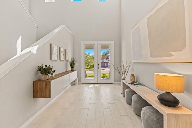 5718 Title Row Dr, Bradenton, FL 34210 - entrance foyer with french doors, a towering ceiling, and wood finished floors