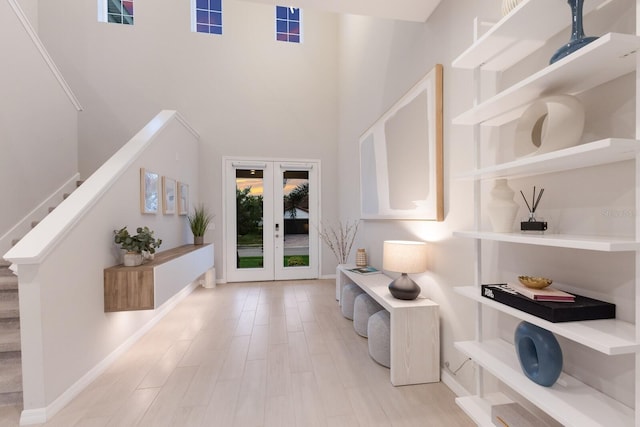 5718 Title Row Dr, Bradenton, FL 34210 - foyer with a towering ceiling, stairs, wood finished floors, and french doors