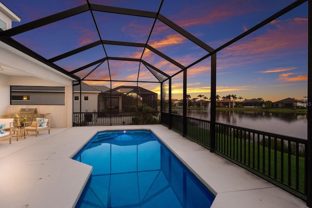 5718 Title Row Dr, Bradenton, FL 34210 - pool at dusk with a water view, a patio area, area for grilling, and a lanai