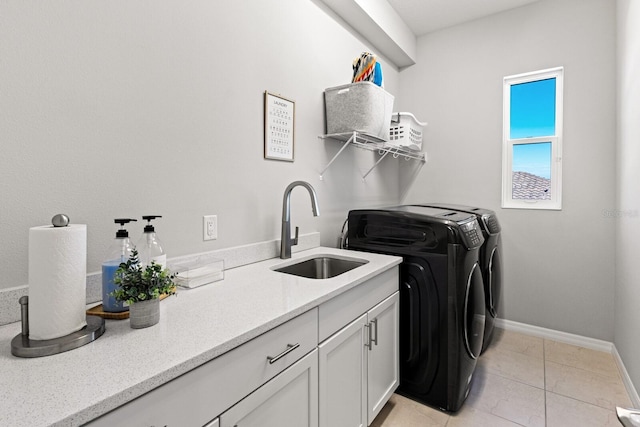 5718 Title Row Dr, Bradenton, FL 34210 - laundry area featuring washer and clothes dryer, cabinet space, and light tile patterned floors