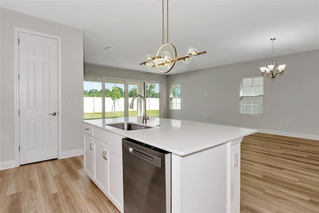 12613 Oak Hill Way, Parrish, FL 34219 - kitchen featuring dishwasher, a chandelier, a sink, light wood-type flooring, and baseboards