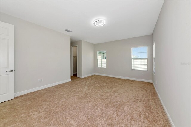 12613 Oak Hill Way, Parrish, FL 34219 - unfurnished room with light carpet and baseboards