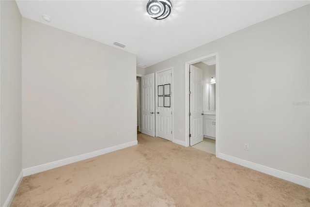 12613 Oak Hill Way, Parrish, FL 34219 - unfurnished bedroom with carpet flooring, baseboards, and ensuite bathroom
