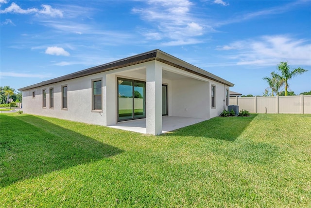 12613 Oak Hill Way, Parrish, FL 34219 - back of house featuring a patio area, stucco siding, and central AC unit