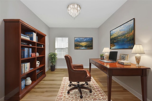 12613 Oak Hill Way, Parrish, FL 34219 - office area with light wood-type flooring, baseboards, and a chandelier