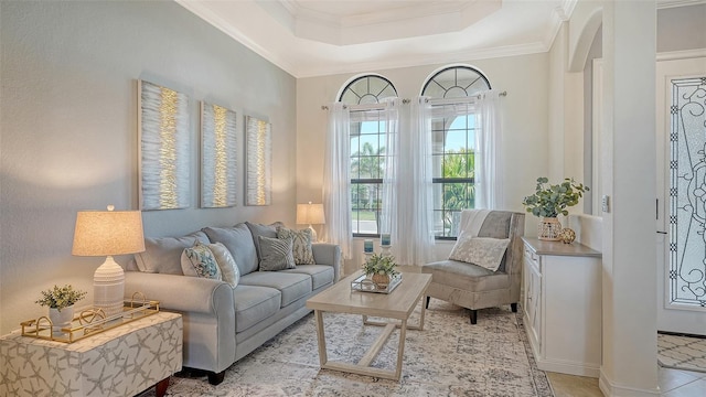 5622 Arnie Loop, Lakewood Ranch, FL 34211 - living room featuring arched walkways, crown molding, and a raised ceiling