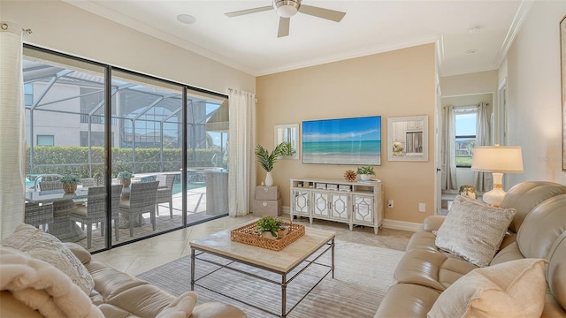 5622 Arnie Loop, Lakewood Ranch, FL 34211 - living area with ceiling fan, a sunroom, crown molding, tile patterned floors, and baseboards