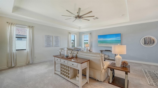 5622 Arnie Loop, Lakewood Ranch, FL 34211 - living area with a raised ceiling, ceiling fan, carpet flooring, healthy amount of natural light, and ornamental molding