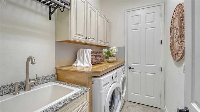 5622 Arnie Loop, Lakewood Ranch, FL 34211 - washroom with washer and dryer, cabinet space, and light tile patterned flooring