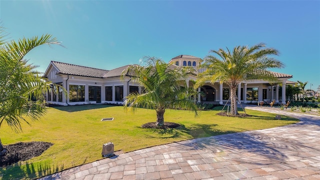 5622 Arnie Loop, Lakewood Ranch, FL 34211 - rear view of house featuring a lawn and a tiled roof
