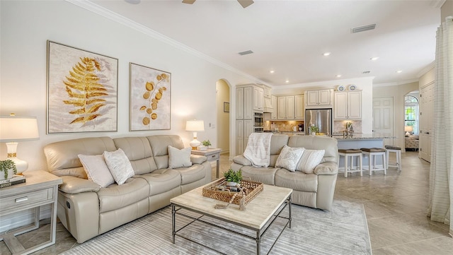 5622 Arnie Loop, Lakewood Ranch, FL 34211 - living room featuring arched walkways, ornamental molding, ceiling fan, recessed lighting, and light tile patterned floors