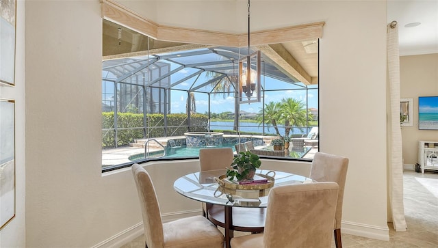 5622 Arnie Loop, Lakewood Ranch, FL 34211 - dining area with a sunroom, a water view, and baseboards