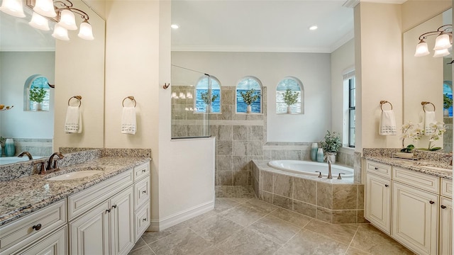 5622 Arnie Loop, Lakewood Ranch, FL 34211 - full bath featuring ornamental molding, a garden tub, two vanities, a walk in shower, and tile patterned floors