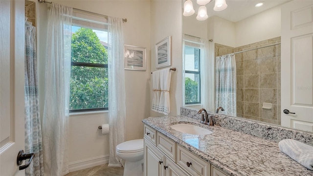5622 Arnie Loop, Lakewood Ranch, FL 34211 - full bath featuring vanity, toilet, a tile shower, tile patterned flooring, and baseboards