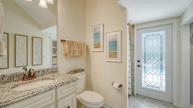 5622 Arnie Loop, Lakewood Ranch, FL 34211 - full bathroom featuring healthy amount of natural light, toilet, vanity, and baseboards