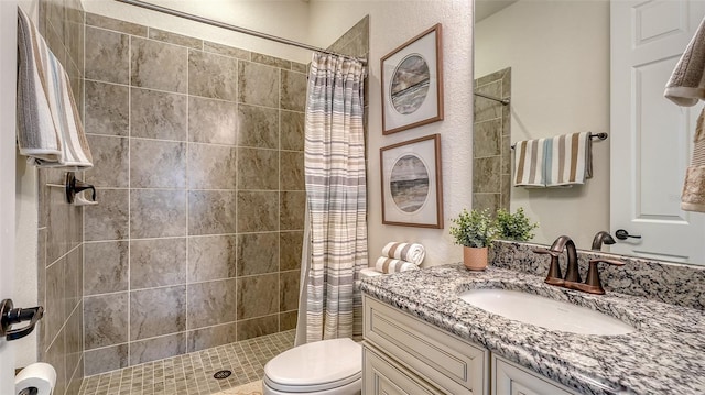 5622 Arnie Loop, Lakewood Ranch, FL 34211 - bathroom with vanity, toilet, and tiled shower