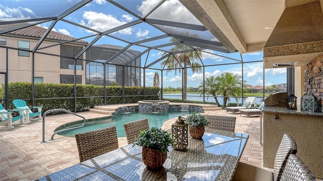 5622 Arnie Loop, Lakewood Ranch, FL 34211 - view of pool featuring a patio area, a water view, a lanai, and a pool with connected hot tub