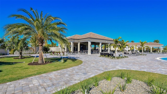 5622 Arnie Loop, Lakewood Ranch, FL 34211 - view of community featuring a patio and a lawn
