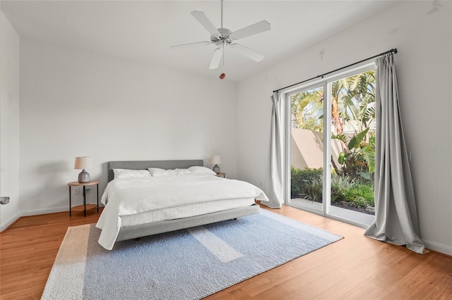 7716 Uliva Way, Sarasota, FL 34238 - bedroom with access to exterior, light wood-type flooring, a ceiling fan, and baseboards