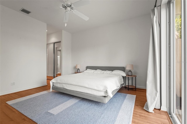 7716 Uliva Way, Sarasota, FL 34238 - bedroom featuring light wood-style flooring, baseboards, and ceiling fan