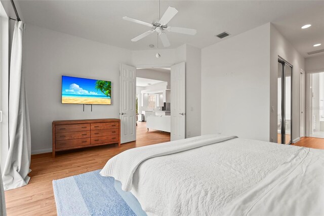7716 Uliva Way, Sarasota, FL 34238 - bedroom with light wood-style floors, recessed lighting, ensuite bath, baseboards, and a ceiling fan
