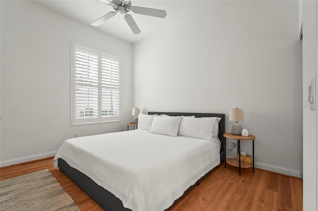 7716 Uliva Way, Sarasota, FL 34238 - bedroom with wood finished floors, baseboards, and ceiling fan
