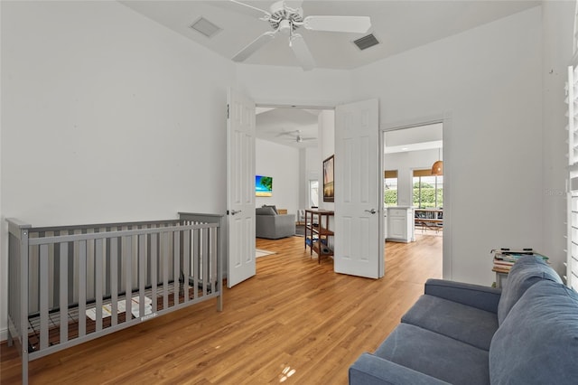 7716 Uliva Way, Sarasota, FL 34238 - living area featuring a ceiling fan and light wood-style flooring