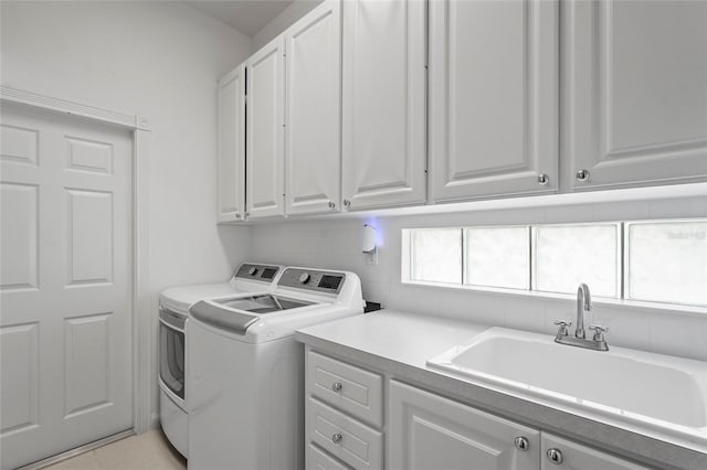 7716 Uliva Way, Sarasota, FL 34238 - laundry room with cabinet space and washing machine and clothes dryer