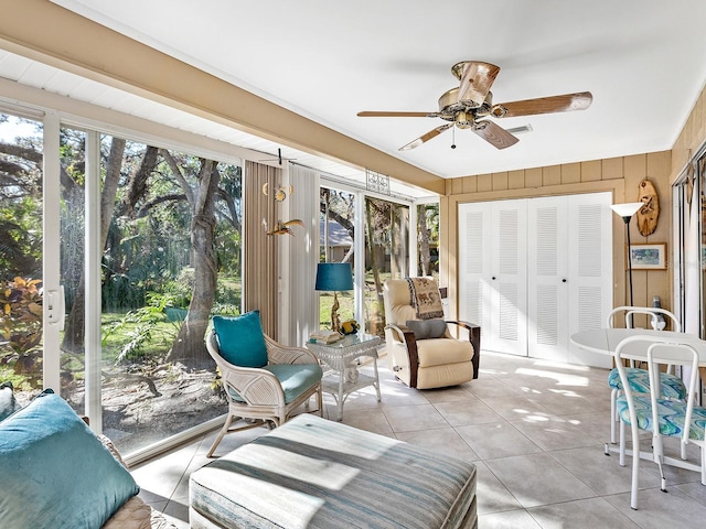 4869 Village Gardens Dr Unit 189, Sarasota, FL 34234 - sunroom featuring tile patterned floors and wooden walls