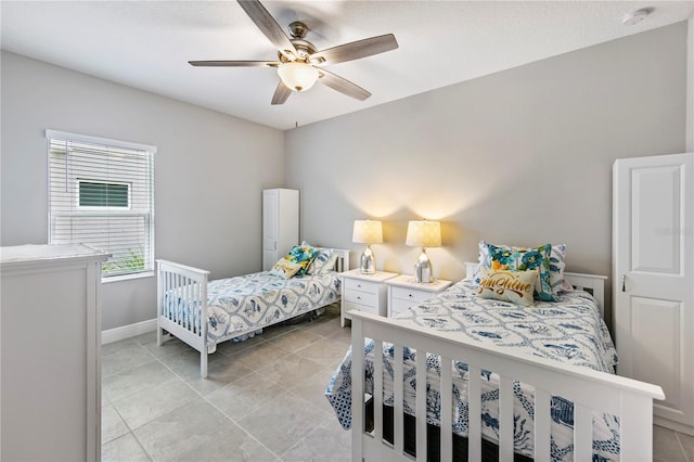 4406 Rustling Pines Ter, Parrish, FL 34219 - bedroom featuring baseboards, ceiling fan, and light tile patterned floors