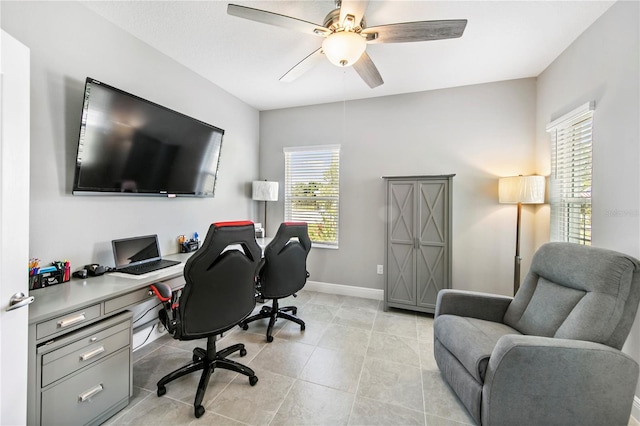 4406 Rustling Pines Ter, Parrish, FL 34219 - home office featuring ceiling fan, baseboards, and light tile patterned floors