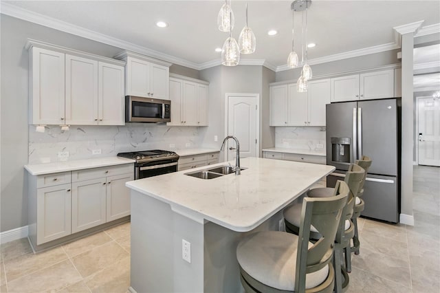 4406 Rustling Pines Ter, Parrish, FL 34219 - kitchen featuring appliances with stainless steel finishes, a sink, a kitchen island with sink, decorative backsplash, and recessed lighting