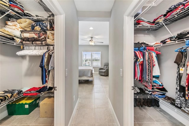 4406 Rustling Pines Ter, Parrish, FL 34219 - walk in closet featuring tile patterned flooring and a ceiling fan
