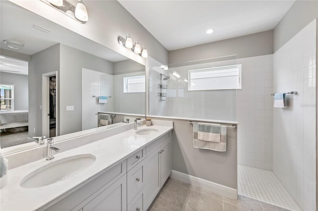 4406 Rustling Pines Ter, Parrish, FL 34219 - full bath featuring healthy amount of natural light, walk in shower, double vanity, and connected bathroom