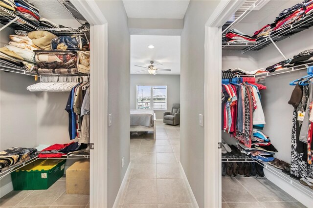 4406 Rustling Pines Ter, Parrish, FL 34219 - walk in closet with tile patterned flooring and a ceiling fan