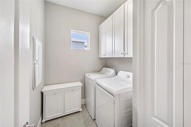 4406 Rustling Pines Ter, Parrish, FL 34219 - washroom featuring cabinet space, washing machine and clothes dryer, and light tile patterned flooring