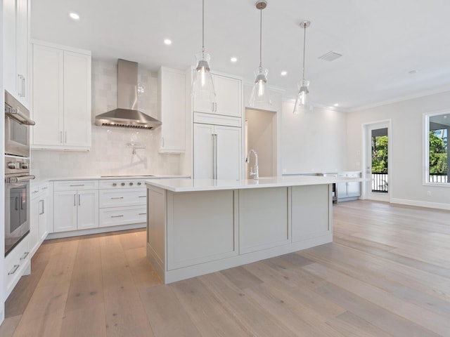 430 Pheasant Way, Sarasota, FL 34236 - kitchen featuring wall chimney exhaust hood, backsplash, recessed lighting, paneled refrigerator, and light countertops