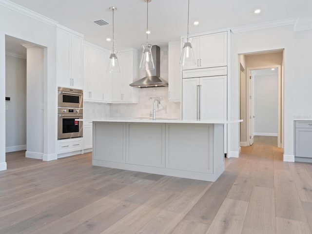 430 Pheasant Way, Sarasota, FL 34236 - kitchen featuring wall chimney range hood, ornamental molding, decorative backsplash, light countertops, and white cabinetry