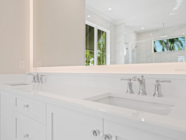 430 Pheasant Way, Sarasota, FL 34236 - full bath with double vanity, a marble finish shower, crown molding, and healthy amount of natural light