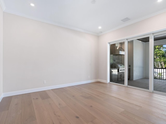 430 Pheasant Way, Sarasota, FL 34236 - spare room featuring light wood finished floors, recessed lighting, and crown molding