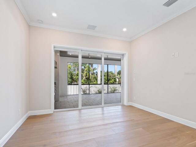 430 Pheasant Way, Sarasota, FL 34236 - empty room with light wood-style flooring, crown molding, recessed lighting, and a smoke detector