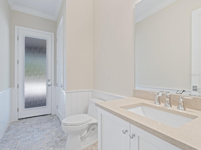 430 Pheasant Way, Sarasota, FL 34236 - bathroom featuring a wainscoted wall, vanity, ornamental molding, and a decorative wall