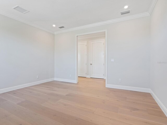 430 Pheasant Way, Sarasota, FL 34236 - unfurnished room with ornamental molding, light wood-style floors, and recessed lighting