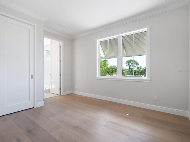 430 Pheasant Way, Sarasota, FL 34236 - unfurnished room featuring ornamental molding and light wood-style floors