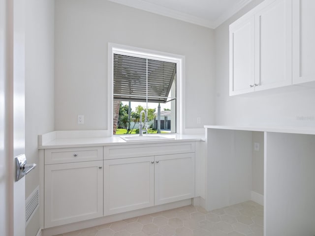 430 Pheasant Way, Sarasota, FL 34236 - laundry room featuring ornamental molding and light tile patterned floors
