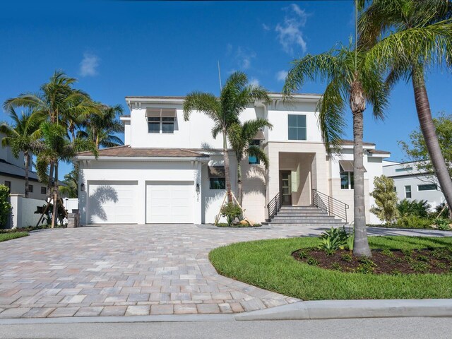 430 Pheasant Way, Sarasota, FL 34236 - view of front of property featuring decorative driveway, stucco siding, and a garage